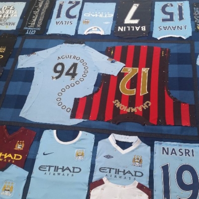 Laying out & pinning Max's Man City football shirt patchwork quilt