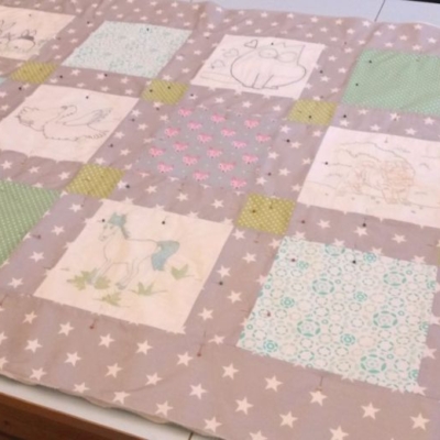 Baby quilt commission ready to be quilted.