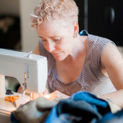 Lisa stitching a bespoke Harris Tweed super king size quilt